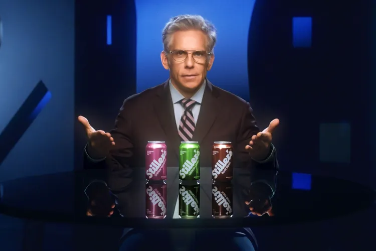 Ben Stiller presenting Stillers Soda cans