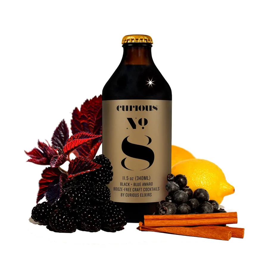 Curious No. 8, a non-alcoholic Mushroom Amaro, beside blackberries and cinnamon.