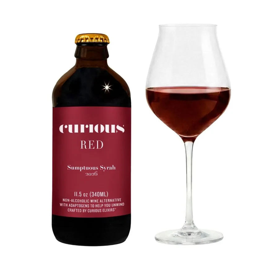 Curious Red, a non-alcoholic wine, bottle beside a poured glass of red wine.